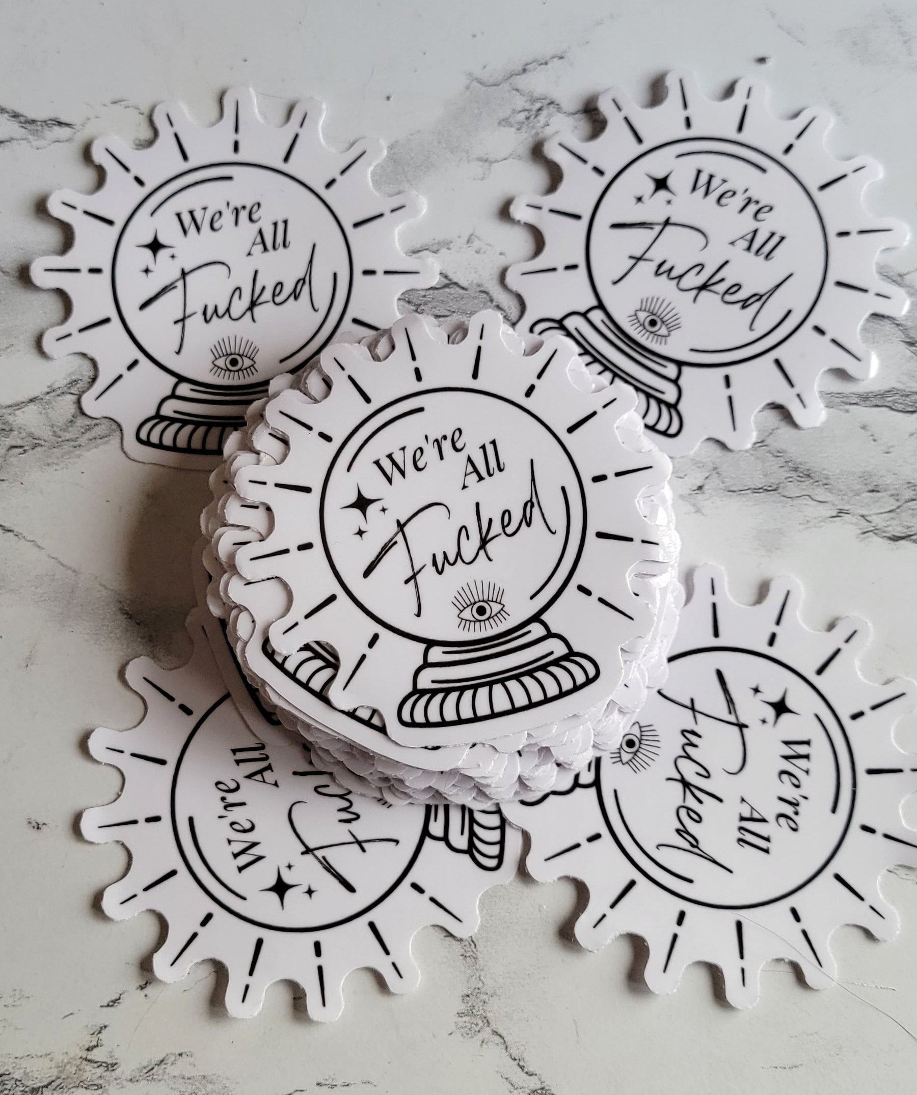 We're all Fckd Sticker